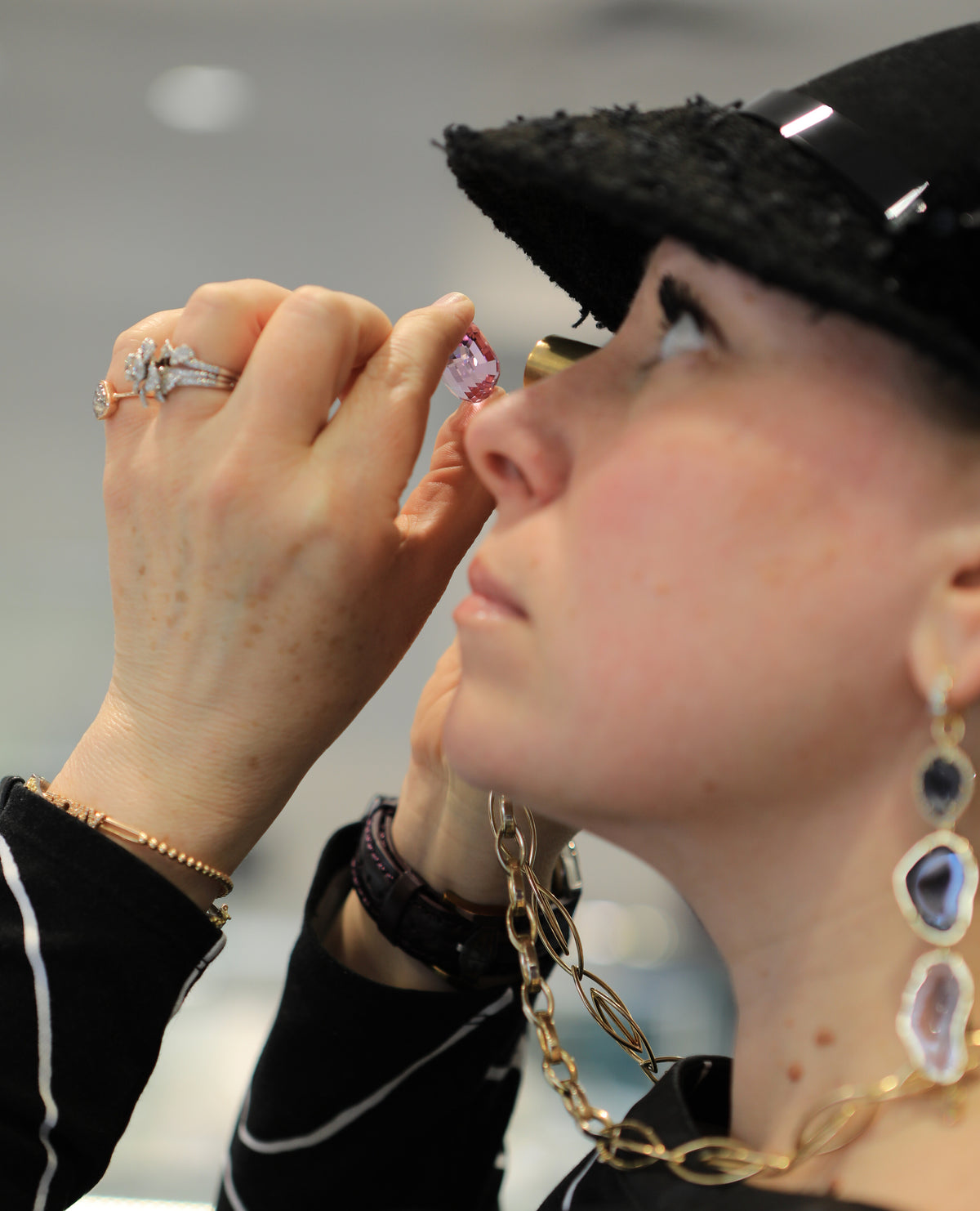 Jeweler examining a gemstone with a loupe