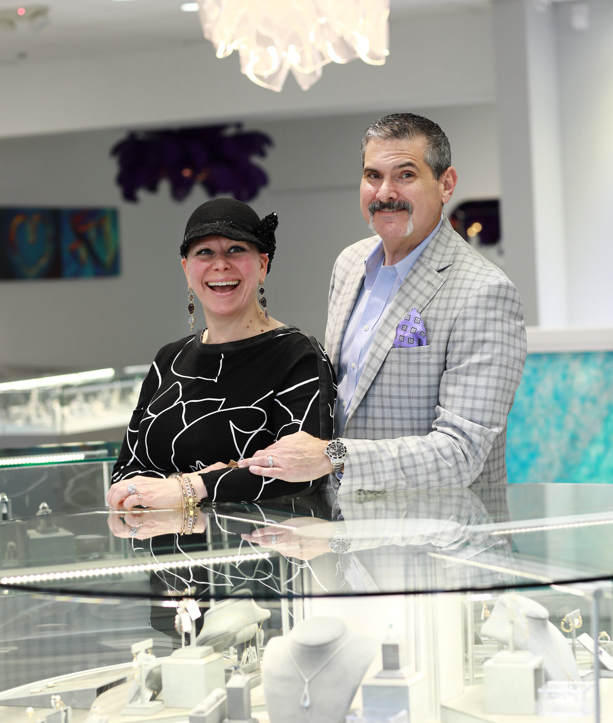 Owners Chris and Jenny at the showcase in the Huntington Jewelers Summerlin showroom