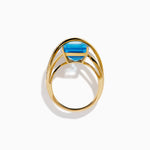 Blue Topaz and Diamond Crossover Ring in 14K Yellow Gold view 3
