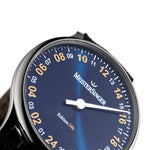 MeisterSinger 24H Edition dial close-up showing the gold 24-hour numerals and single hand