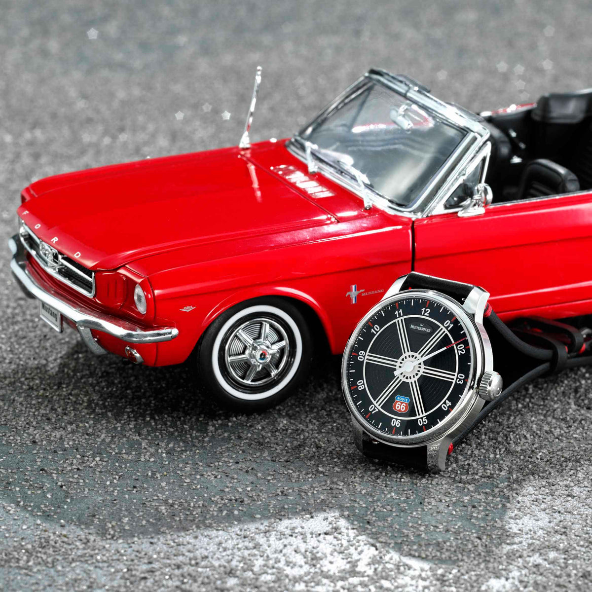 MeisterSinger Edition Route 66 watch beside the included 1:18-scale red Ford Mustang Convertible model, angle view