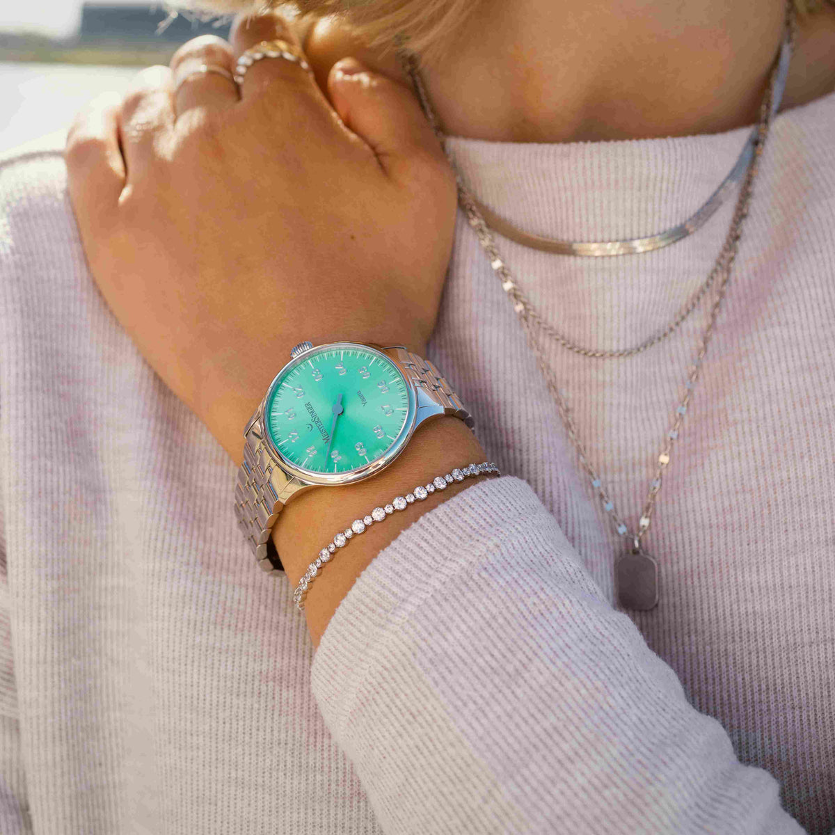 MeisterSinger Yaara women's watch with mint dial and stainless steel bracelet, lifestyle view