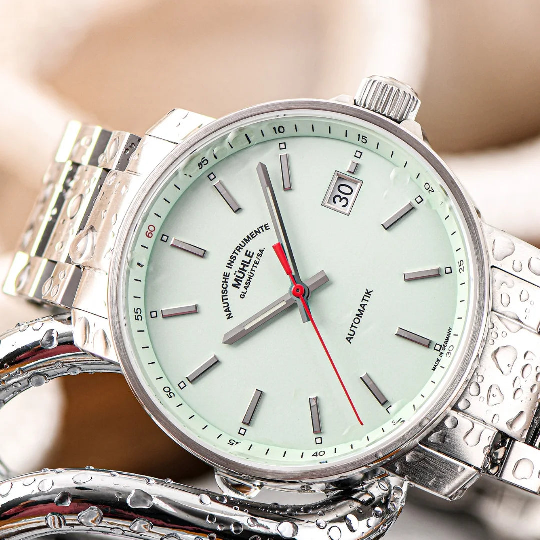 Mühle-Glashütte 29er with mint dial and stainless steel bracelet, close-up lifestyle view