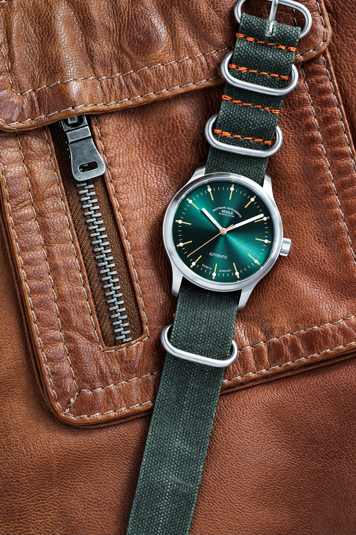 Mühle-Glashütte Panova Green on a brown leather jacket