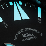 Luminous minute markers and Mühle Glashütte dial printing, close-up