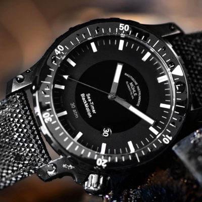 Close-up of the Sea-Timer BlackMotion black dial and rotating bezel
