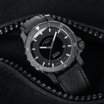 Sea-Timer BlackMotion on a dark fabric background