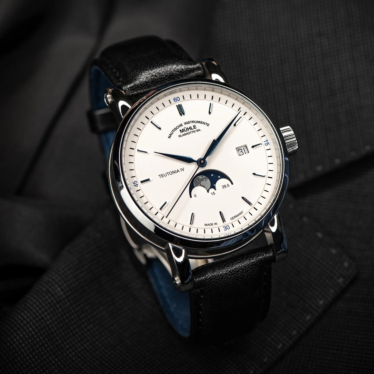 Mühle-Glashütte Teutonia IV Moonphase men's watch with white dial and black calf leather strap, angle view