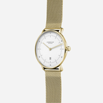 Sternglas Naos XS gold-tone watch, angled view showing the crown and slim 33mm case